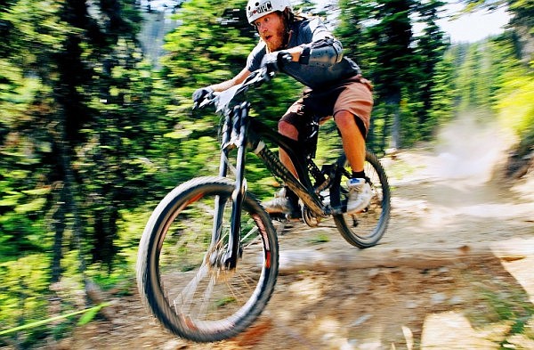 Ray Peacock speeds his way down through the course during the 2nd Annual Grizzly Downhill Bike Race at the Whitefish Mountain Resort at Big Mountain Saturday afternoon. Just over 40 racers competed in the event, which was run on the Runaway Train trail.