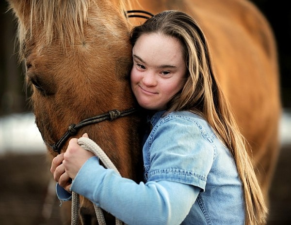 Cedar Vance with one of her horses on Monday, March 8, at her home north of Whitefish.