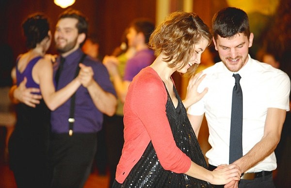 Pete Milne and Caitlin Hills doing Lolly Kicks as they dance a Balboa style swing dance at the Sassafras Ballroom in Kalispell on Friday, April 2.