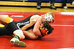 Cody Ishler, a wrestler from Alberton who co-ops with the Frenchtown program, takes down his opponet and quickly works to pin him at the Superior Invitational held back on Dec.11.