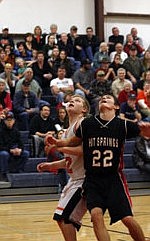 Hot Springs sophomore Wyatt Nagy boxes out Carson Lilja for an upcoming rebound.
