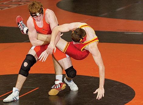 Flathead&#146;s Mason Smith, left, slings Missoula Hellgate&#146;s Pete Gilleard to the ground during Thursday night&#146;s 189-pound weight class match held at Flathead High School. Craig Moore/Daily Inter Lake