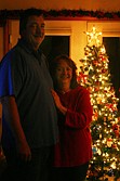 Deanna Lapierre-Anidom and her husband, Xxxx Xxxxxx, pose in front of their Christmas tree during last Saturday's Tour of Homes.