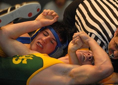 Whitefish High School&#146;s Steve Gary puts Whitefish&#146;s Kaleb Prestegaard into a bad position during a wrestling match in Whitefish on Friday. Garrett Cheen/Daily Inter Lake