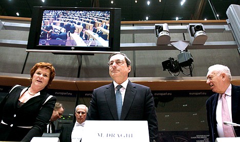 &lt;p&gt;European Central Bank (ECB) President Mario Draghi, center, prepares to take his seat during a meeting of the Economic and Financial Committee at the European Parliament in Brussels, Monday, Dec. 19, 2011. The ECB has faced calls to step up its bond-buying program in an effort to stem the eurozone debt crisis but appears determined to limit its support for indebted governments as they try to dig their way out of trouble. (AP Photo/Virginia Mayo)&lt;/p&gt;