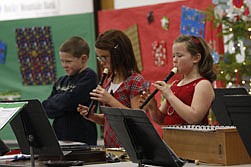 Fourth-graders Cole McCrea, Kassidy Kenzie, and Natalee Deschamps perform &quot;Ode to Joy&quot; on recorder at the Elementary Christmas Concert last Thurday evening.