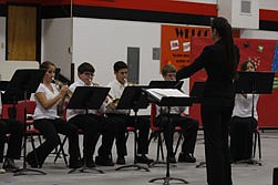 Brittany Majerus directs the Middle School Band trumpet section. From left to right, Sheridan Martin, Jonathan Buchanan, Chayton Lulack, Warren Wood, and Mara Winston.