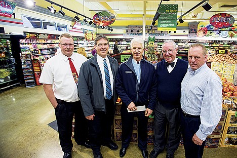 &lt;p&gt;Super 1 Foods management present Christmas for All with a donation of $8,538 recently at the Hayden grocery store. From left, Brian Howell,Randy McIntire, Jim Thompson, publisher for the Press, Ron McIntire, Super 1 founder, and Eric Haakensen, communication division controller for the Hagadone Corporation.&lt;/p&gt;