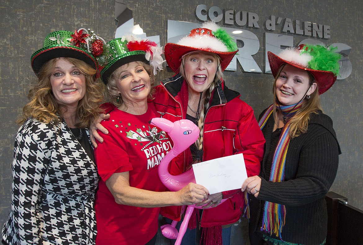 &lt;p&gt;Devin Heilman with the Coeur d&#146;Alene Press, right, accepts a $500 donation for Press Christmas for All from the Red Hot Mamas entertainment group. From left, Debby Carlson, Mikki Stevens and Deborah Miranda stopped by to drop off the check.&lt;/p&gt;