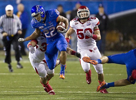 &lt;p&gt;Boise State running back Doug Martin (22) tries to escape the grasp of Utah defenders Chaz Walker and Matt Martinez (52) during the first half of the Maaco Bowl on Wednesday night at Las Vegas.&lt;/p&gt;