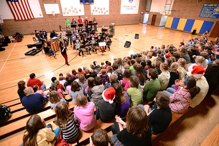 &lt;p&gt;Karen Ulmer, director of the Columbians, addresses the assembled students at Helena Flats School on Friday, December 20. In the background are members of the Columbians, the premiere band at Columbia Falls, and students from the band at Helena Flats. Sally Newberry, band director at Helena Flats said she approached Ulmer about having some of her students join with the Columbians earlier in the year. &quot;This has been the best field trip, the best experience,&quot; said Newberry. Newberry hopes to make this an annual event. (Brenda Ahearn/Daily Inter Lake)&lt;/p&gt;