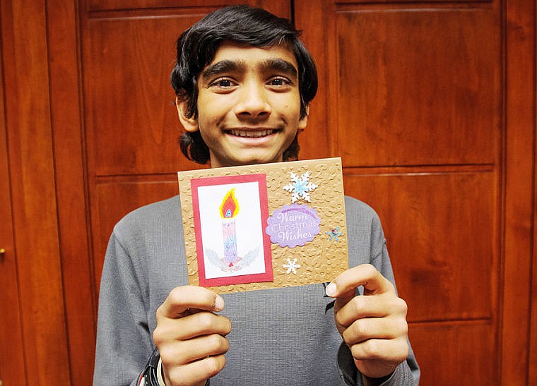 &lt;p&gt;Finney Manchala displays one of his Christmas cards.&lt;/p&gt;