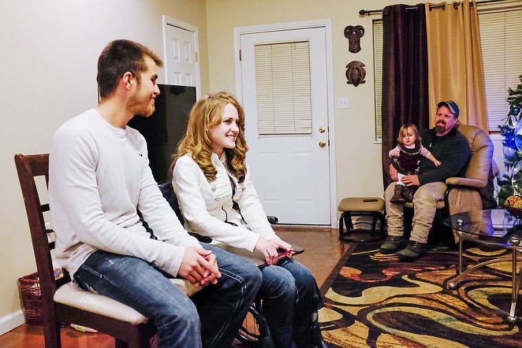 &lt;p&gt;Starla Barnes with her husband, Shannon, and her father, Zeph Hilliad, holding her daughter Elissiah. Dec. 17, 2013 in Kalispell, Montana. (Patrick Cote/Daily Inter Lake)&lt;/p&gt;