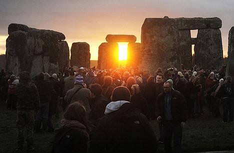 &lt;p&gt;People watch the sunrise at the northern Winter Solstice celebration at Stonehenge in Wiltshire, Thursday. The omens are good that 2012 will be an excellent year, a druid said today, after the sun shone on Stonehenge during a dawn ceremony to mark the winter solstice. One of the most famous sites in the world, Stonehenge is composed of a circular setting of large standing stones set within earthworks, believed to be thousands of years old.&lt;/p&gt;