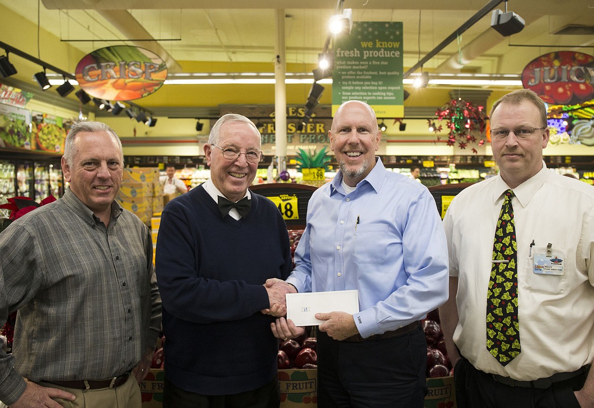 &lt;p&gt;Super 1 Foods presents the Coeur d'Alene Press with a $10,335 donation to Press Christmas For All on Monday. From left to right: Eric Haakenson with the Hagadone Corporation, Ron McIntire, president of Super 1 Foods, Larry Riley, publisher of the Coeur d'Alene Press, and Brian Howell, store director with Super 1 Foods.&lt;/p&gt;