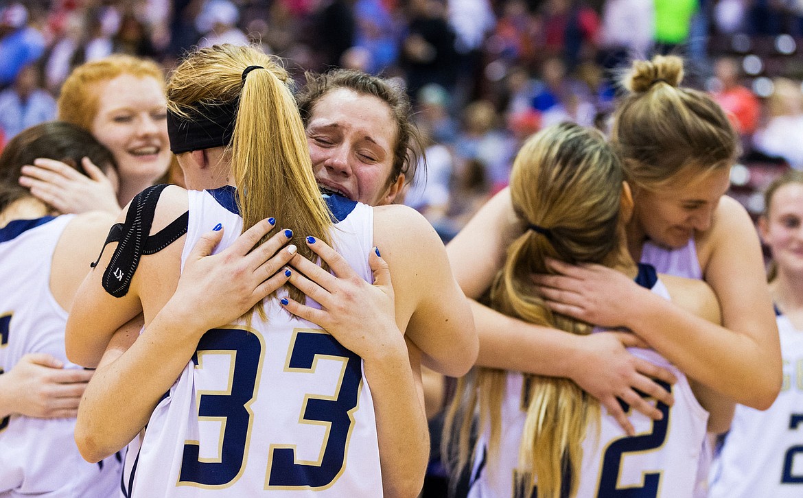 &lt;p&gt;SHAWN GUST/Press Timberlake's Allison Kirby hugs Keelie Lawler (33) after winning the state 3A girls basketball title on Feb. 20, 2016.&lt;/p&gt;