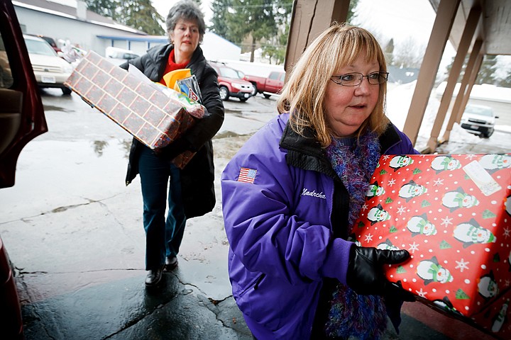 &lt;p&gt;JEROME A. POLLOS/Press Debbi Nadrchal, right, and Barbara Turner with the Coeur d'Alene Elks Lodge deliver $2,500 in gifts Thursday to the North Idaho Violence Prevention Center for families the lodge adopted for Christmas. The donation contained food, toys and household items.&lt;/p&gt;