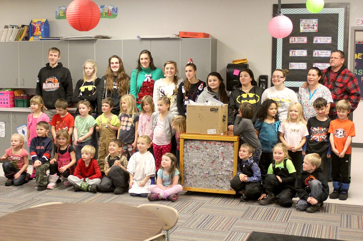 &lt;p&gt;&lt;strong&gt;Amy and Brian Reed join the Plains kindergarten class to tell them they won the pizza contest for collecting the most pop tabs.&lt;/strong&gt;&lt;/p&gt;