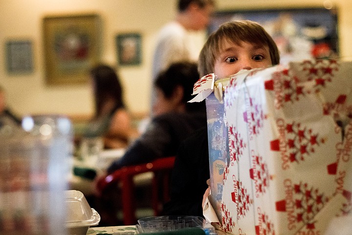 &lt;p&gt;SHAWN GUST/Press A young boy from the Children's Village reacts after receiving a gift from Santa Thursday during the organization's annual Christmas party at Tito Macaroni's at the Coeur d'Alene Resort Plaza Shops. Tito's donated gifts and pizzas for nearly 20 children as well as staff from the Children's Village.&lt;/p&gt;