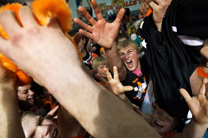 &lt;p&gt;SHAWN GUST/Press Denley Waldo, a senior at Post Falls High, reaches for a stuffed pig Friday after his school won the annual basketball rivalry with Lakeland High known as Prairie Pig in Post Falls.&lt;/p&gt;
