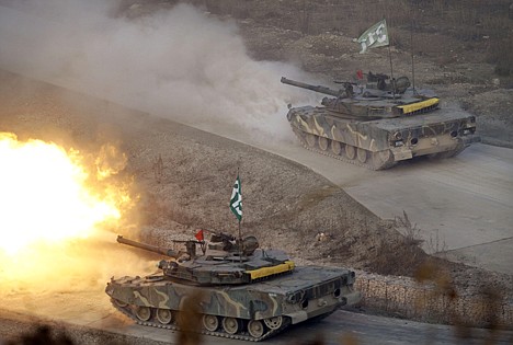 &lt;p&gt;South Korea K-1 tanks fire live rounds during the largest joint air and ground military exercises on the Seungjin Fire Training Field in mountainous Pocheon, 20 miles from the Koreas' heavily fortified border, in South Korea on Thursday.&lt;/p&gt;