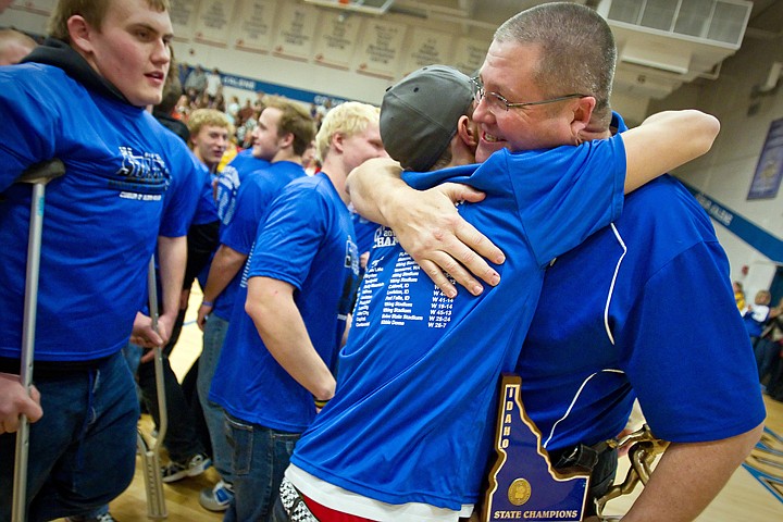 &lt;p&gt;JEROME A. POLLOS/Press Todd Gilkey, the Coeur d'Alene High School activities director, hugs one of the players from the Viking's football team during a rally Tuesday to celebrate the team's state title. The team earned their school the first state football title in a quarter century after beating Centennial High during the championship game Nov. 19.&lt;/p&gt;