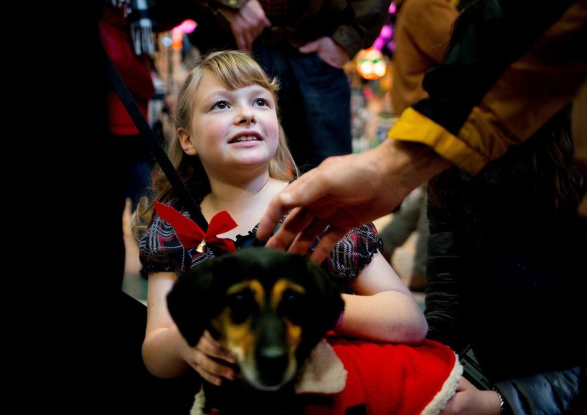 &lt;p&gt;Katherine Reiswig, 9, pets Abby the Terrier Manchester during &quot;Holiday with the Humane Society,&quot; a pet adoption and fundraising event on Wednesday at the Silver Lake Mall in Coeur d'Alene. Reiswig, of Coeur d'Alene, created the event in partnership with the Kootenai Humane Society.&lt;/p&gt;