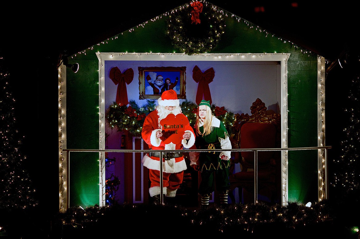 &lt;p&gt;JEROME A. POLLOS/Press Santa and his elf read names from the &quot;good list&quot; as children aboard a cruise ship wait to hear their names.&lt;/p&gt;