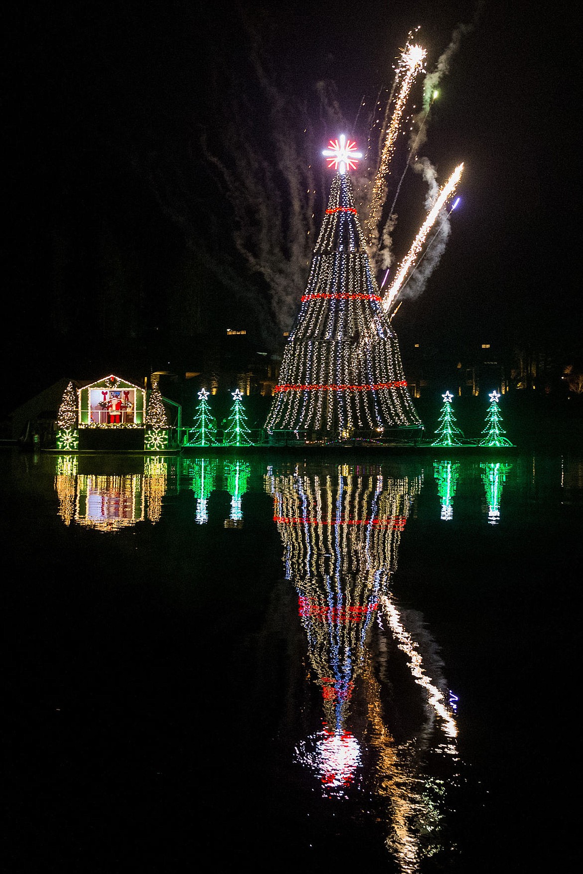 &lt;p&gt;SHAWN GUST/Press Fireworks explode over a 60-foot tall animated floating Christmas tree at the &#147;North Pole&#148; feature of the holiday lights cruise.&lt;/p&gt;