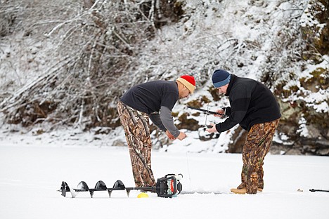 &lt;p&gt;Idaho Army National Guard Sgt 1st Class Henry Carr, left, and Staff Sgt. Jason Rzepa, who lost both of his legs in combat and is now fitted with prosthetics, drop a bait line Friday while ice fishing together on Fernan Lake. The two soldiers served together in Iraq and are glad to be home with their families for Christmas.&lt;/p&gt;