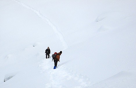 &lt;p&gt;Shawn Gust and Gabe Green, staff photographers for the Press, negotiate a steep slope Saturday during the approach to Revett Lake.&lt;/p&gt;