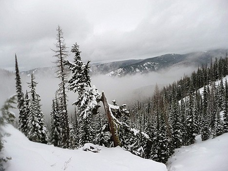 &lt;p&gt;Low-hanging clouds fill a valley seen from a clearing along the route to Revett Lake.&lt;/p&gt;