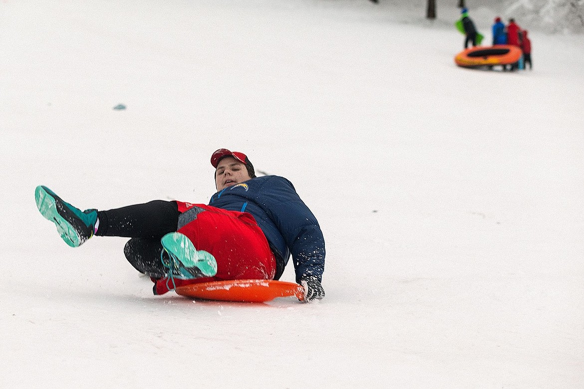 &lt;p&gt;Austin Greatwalker-Larock, 16, tries to hold together two pieces of a broken saucer underneath himself while sledding down Cherry Hill.&lt;/p&gt;