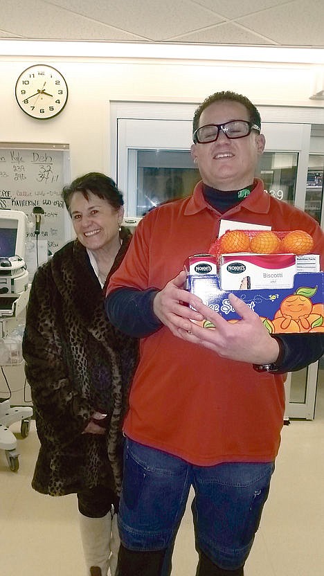 &lt;p&gt;Scott Cisneros and his mother deliver treats to the intensive care unit of the hospital where Cisneros was treated following a snowboarding crash 15 years ago.&lt;/p&gt;