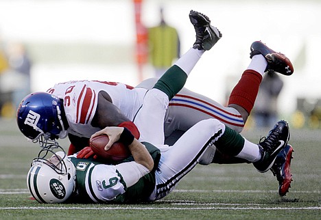 &lt;p&gt;New York Giants defensive end Jason Pierre-Paul, top, sacks New York Jets quarterback Mark Sanchez during the second quarter Saturday at East Rutherford, N.J.&lt;/p&gt;