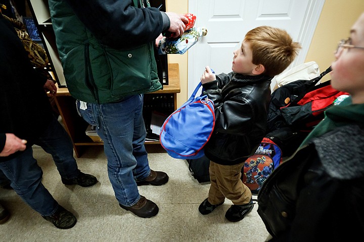 &lt;p&gt;Judah Lamb, 6, presents a bag to one of the Fresh Start patrons Friday morning after Lamb and his family delivered 50 bags filled with clothing and toiletry items and 100 gifts to the drop-in center in downtown Coeur d'Alene.&lt;/p&gt;