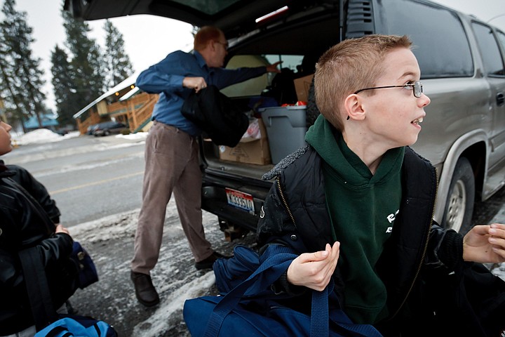 &lt;p&gt;Bubba Lamb, 10, carries an armful of bags into Fresh Start as his father Chad unloads more bags to his younger brothers.&lt;/p&gt;