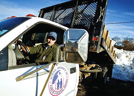 &lt;p&gt;Larry Harwood dumps a load of snow removed from a school parking lot at one of the Coeur d'Alene School District's snow dump sites in Midtown.&lt;/p&gt;