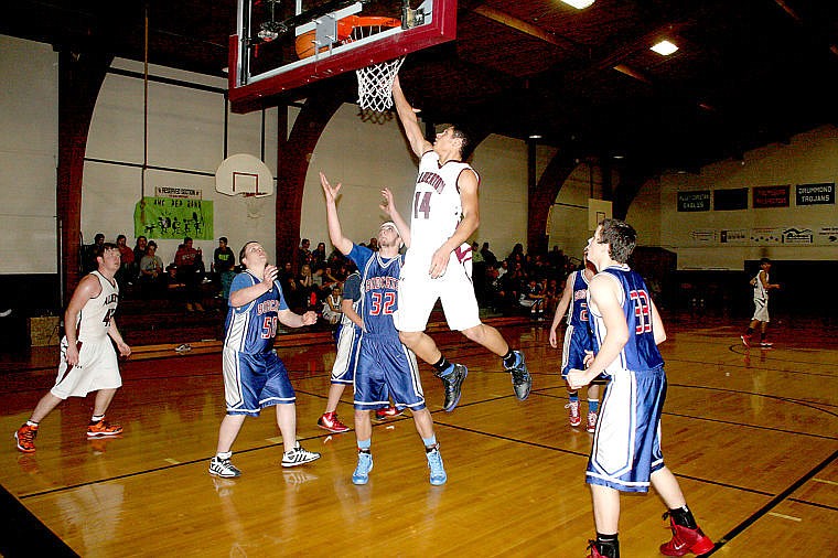 <p>Keir Sanzano of Alberton goes up for a dunk as Superior's Wyatt Zylawy and Howard Zelson get ready to rebound.</p>