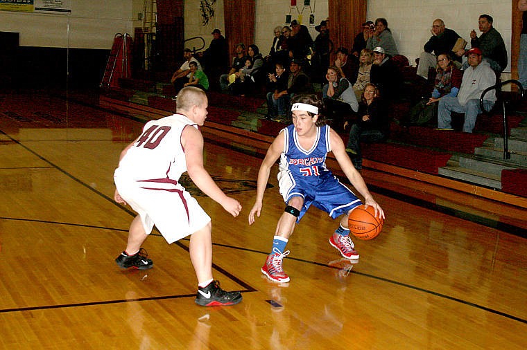 <p>Superior's Jarrod Tippens dribbles the ball as he looks for an opening past Alberton player Nick Turnbull at their game last Tuesday.</p>