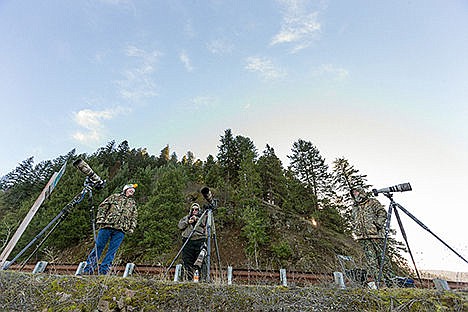 &lt;p&gt;Photography enthusiasts Larry Krumpelman, of Post Falls, far left, Toni Faust, of Richland, WA, and Mark Planck, of Moscow, far right, take a break from photographing bald eagles Monday in the shadow of Mineral Ridge near the shore of Lake Coeur d&#146;Alene&#146;s Beauty Bay.&lt;/p&gt;