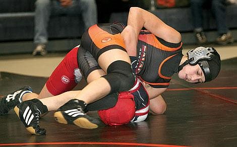 Photo by Ed Moreth&lt;br&gt;Plains-Hot Springs wrestler Rio Crismore puts opponent Cass Cline in a tangle during a battle between the Savage Horsemen and the Arlee Warriors. Crismore pinned Cline in 1:35.