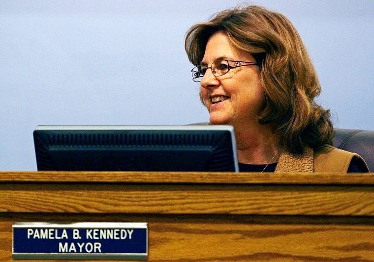 Pam Kennedy Carbonari smiles while conducting her final City Council meeting on Monday night.