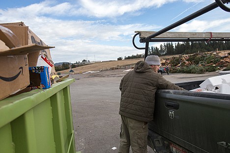 &lt;p&gt;At the Ramsey Transfer Station, Brandon Svelmoe disposes of cardboard boxes left-over from Christmas morning.&lt;/p&gt;