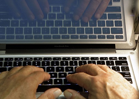 &lt;p&gt;In this Feb. 27, 2013 photo illustration, hands type on a computer keyboard in Los Angeles. Companies including Google and the Huffington Post are trying everything from deploying moderators to forcing people to use their real names in order to restore civil discourse on online comment threads.&lt;/p&gt;