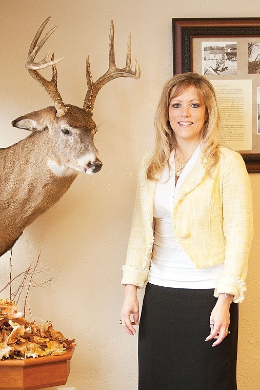 &lt;p&gt;Karin Holder stands near a mounted whitetail deer on display at
her office in Whitefish. The mount is made from the antlers of a
deer Holder's father shot and the cape is from a deer she took.&lt;/p&gt;