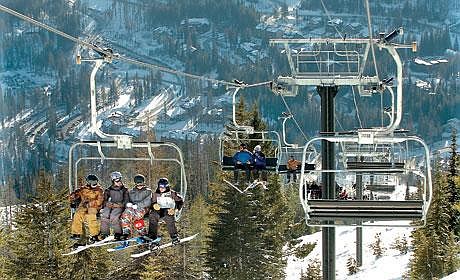 ON THE opening day of Whitefish Mountain Resort on Dec. 8, skiers and snowboarders take the new Chair 1 up to the summit of the mountain. Resort operator Winter Sports Inc. has spent $20 million on resort improvements over the past year. Karen Nichols/Daily Inter Lake