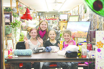 &lt;p&gt;Representing the Polson Boys and Girls Club, Tabitha Boyle, background, joins Rainn, Jasmine M., and Sara to do some crocheting at last Friday night's seasonal festivities along Main Street in Polson.&lt;/p&gt;