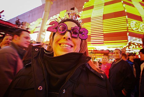 &lt;p&gt;In this Monday, Dec. 31, 2012, photo, Carmen Zepeda, of Corpus Christi, Texas, shows off her 2013 New Year's Eve glasses at the Fremont Street Experience Downtown Countdown in Las Vegas. On New Year's Eve night, some 340,000 people spending some $226 million, will crowd the Strip and downtown Fremont Street expecting to be entertained and for that reason, Las Vegas casino operators, event planners, tourism agencies and more have spent months planning ways to wow.&lt;/p&gt;