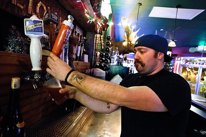 &lt;p&gt;Josh Phillips, bartender at the Moose Lounge in Coeur d'Alene, pours a draft beer Monday during his shift. The city of Coeur d'Alene is considering pair of rule changes with improved downtown safety being the focus.&lt;/p&gt;